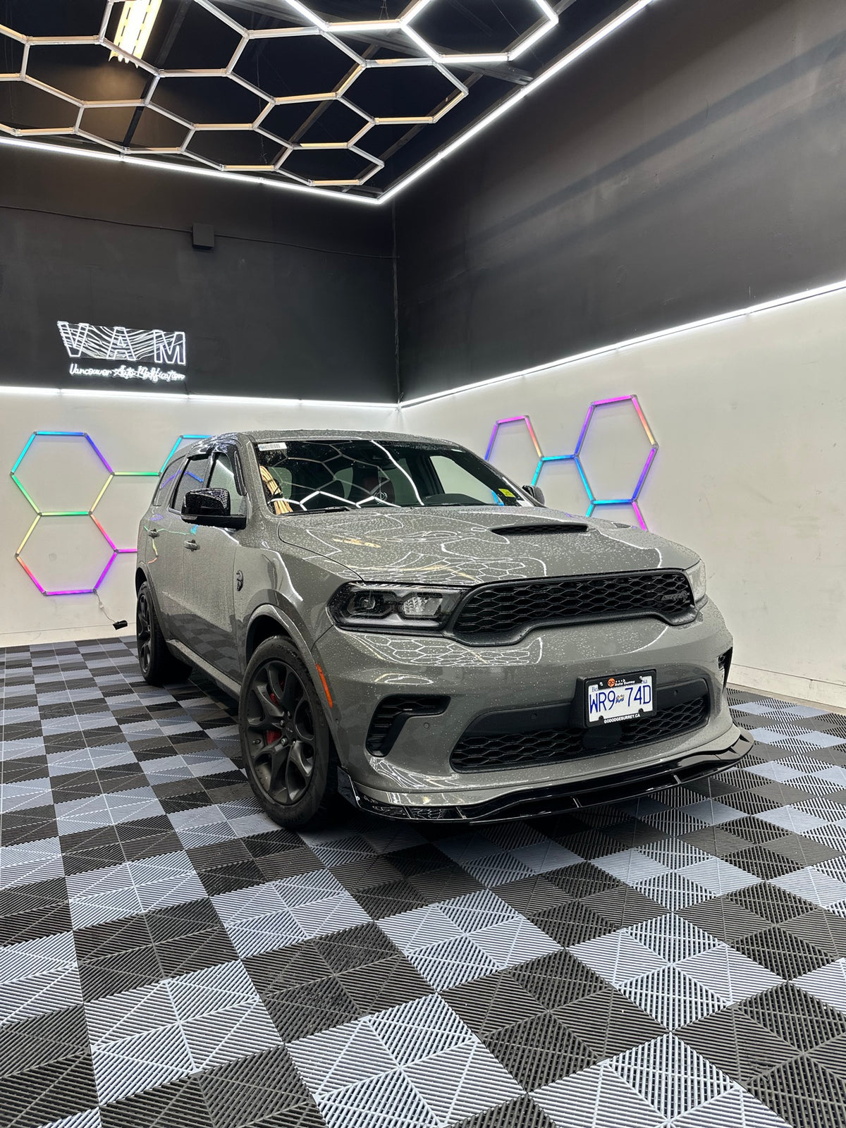 Dodge Durango with gloss black front lip installed - front view